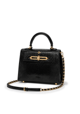 Black handbag with gold accents on a white background