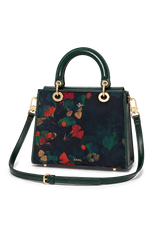 Green handbag with floral pattern on a white background